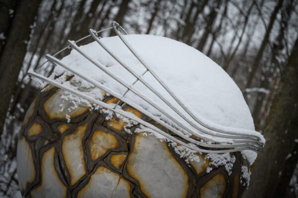 Northwood global sculpture covered in snow